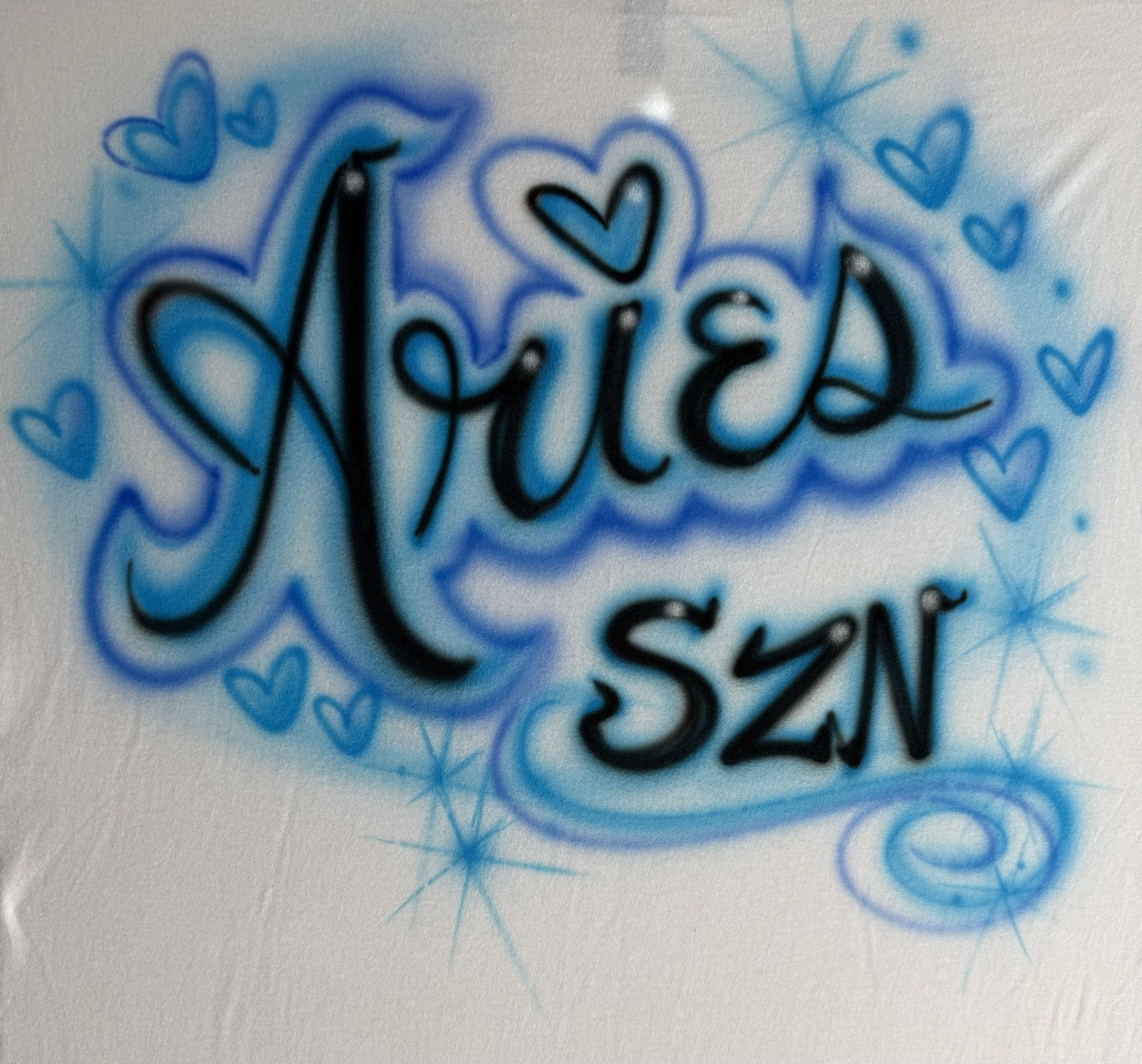 Airbrushed zodiac lettering with hearts by Tina Cozart