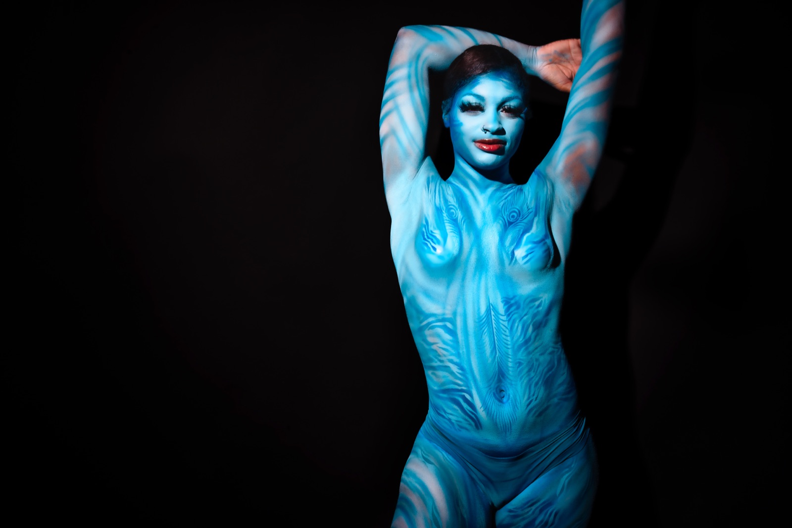Indigo — UV body art by Tina Cozart