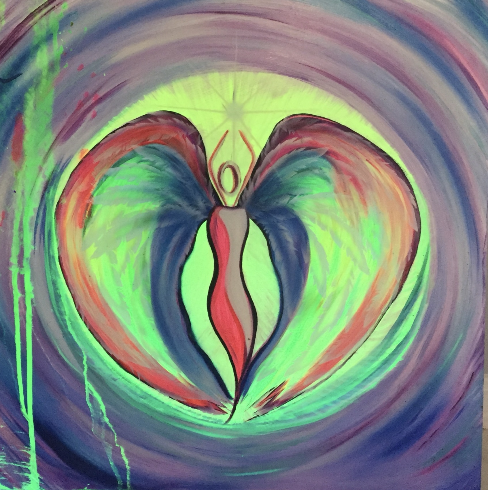 A glowing UV-reactive heart design lit under black light, by Tina Cozart