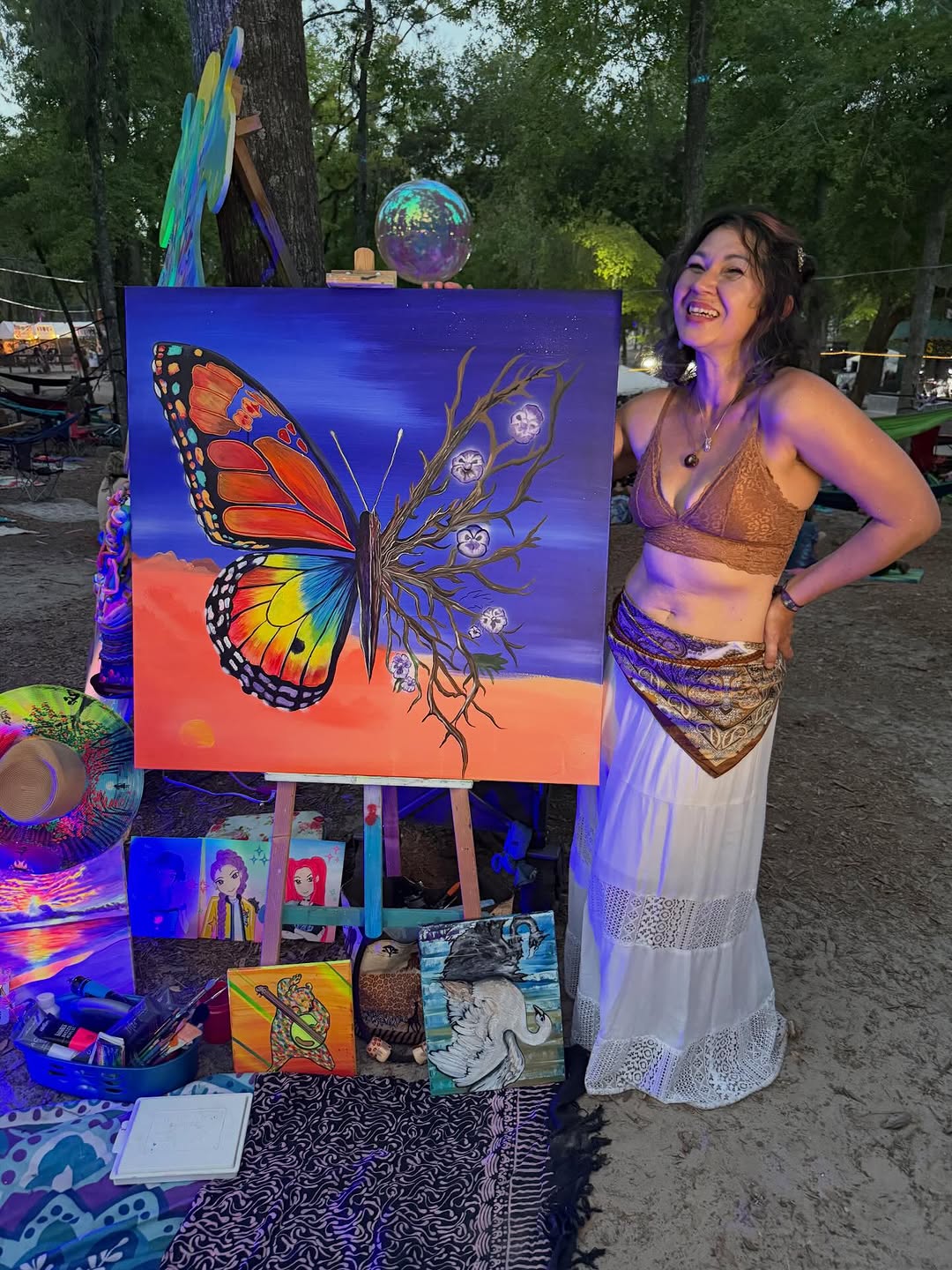 A monarch-butterfly painting by Tina Cozart, hung on a gallery wall